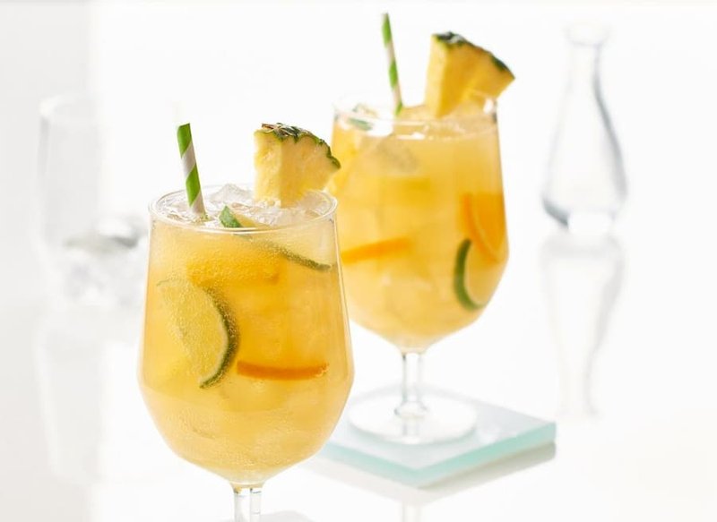 Pineapple Sangria requires a few more ingredients than a traditional Mimosa, but this option is great for events and parties!