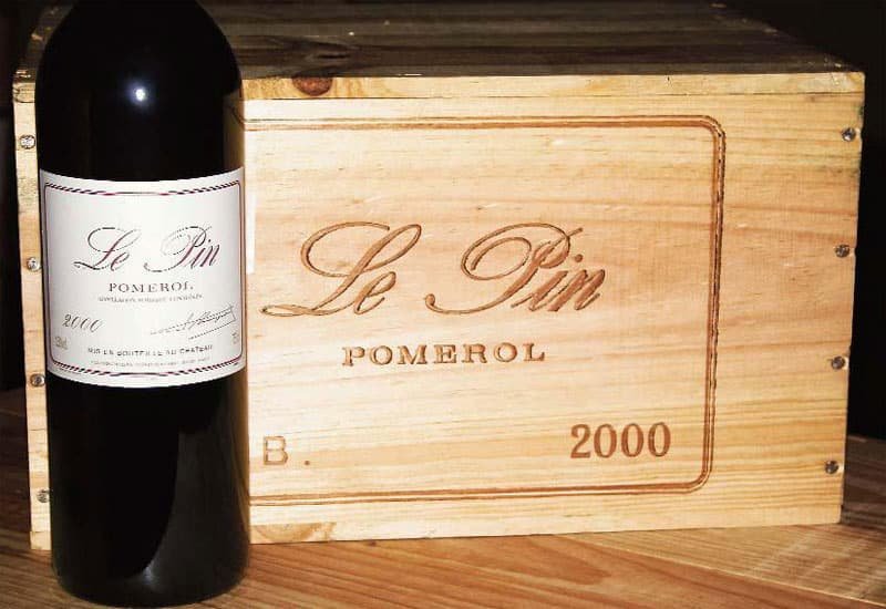 A classic Merlot, this 2000 Le Pin Merlot wine displays a deep ruby color in the glass.