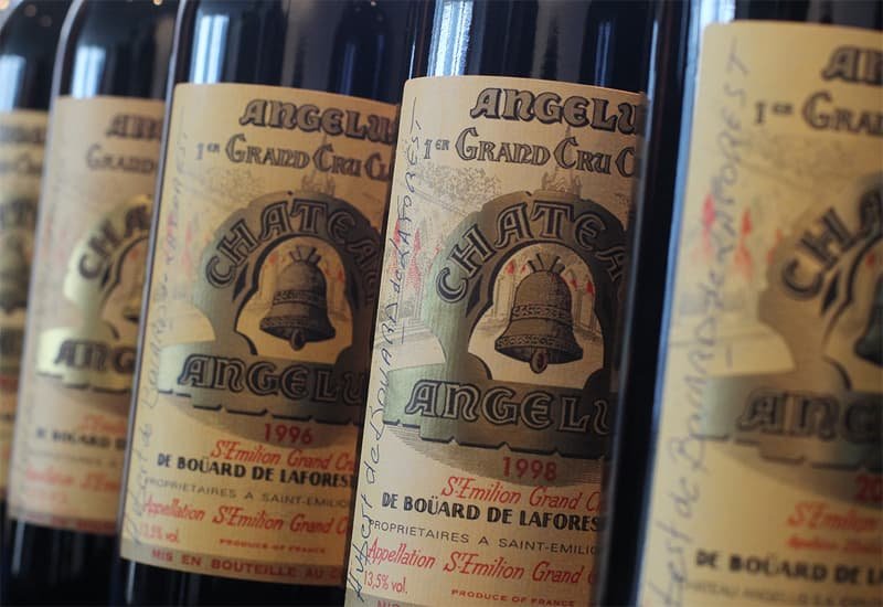 The label of Chateau Angelus wines has always included a bell on a light background.