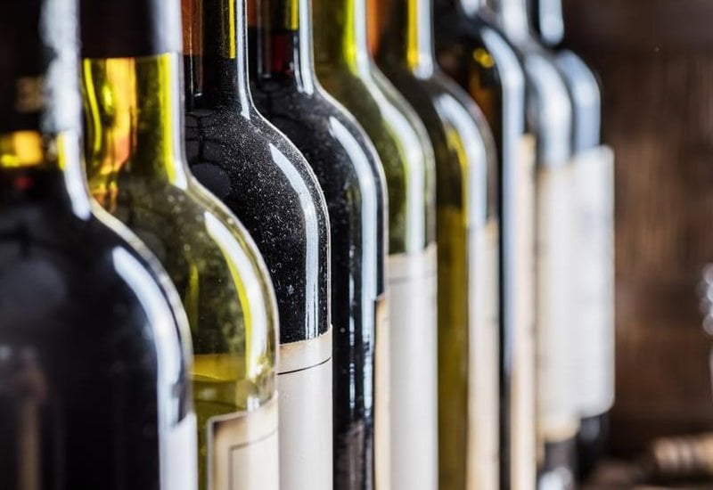 Wine critics like Robert Parker and wine magazines like Wine Spectator have developed numerical scales to rate wines based on factors, including flavor, aroma, and age which contribute to wine valuation.