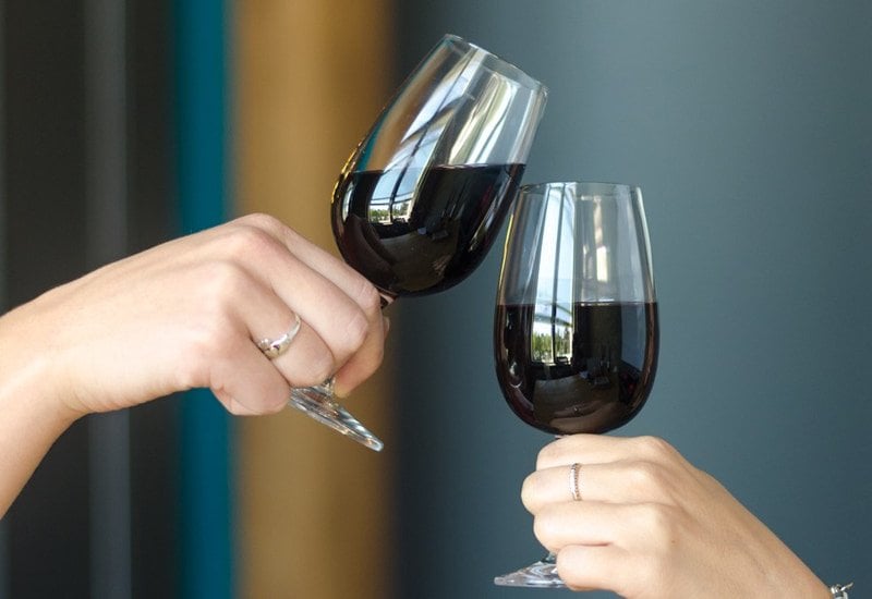 You should hold your wine glass by the stem, so the warmth from your hand doesn’t transfer to the wine. 
