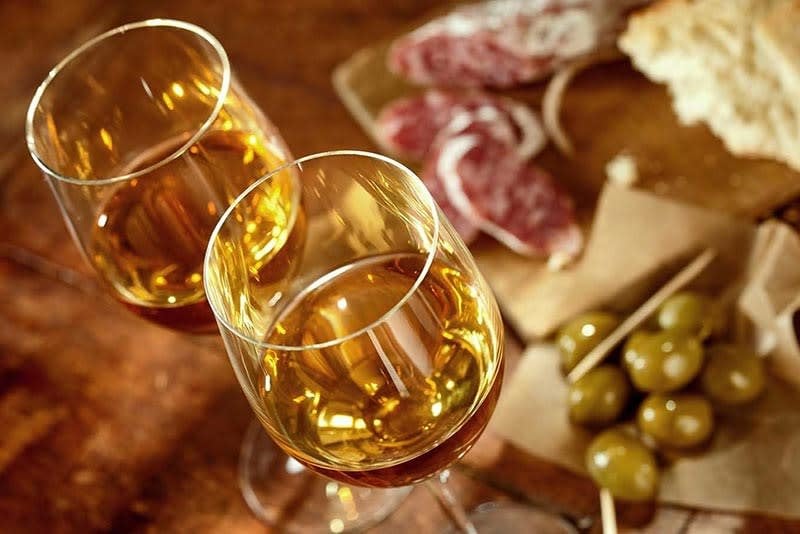 Sherry wine paired with cured meats and olives.