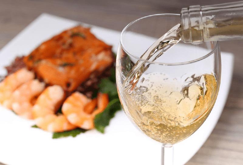 Salmon dish paired with white wine.