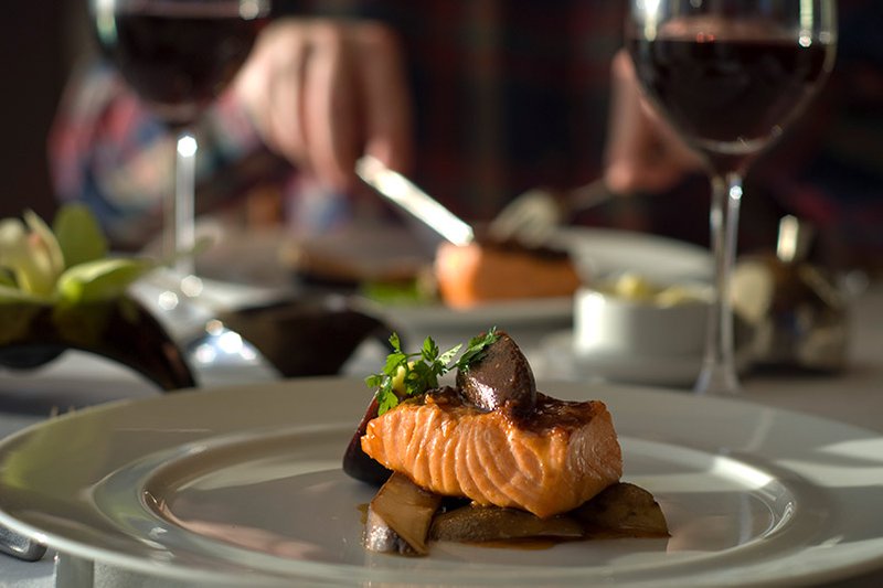 Light bodied red wine paired with grilled salmon.